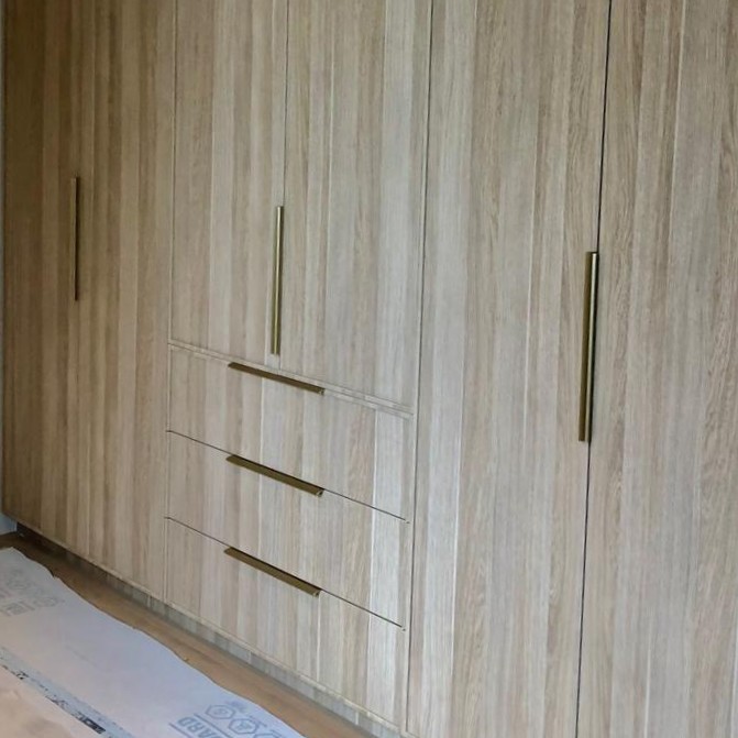 Built-in wardrobe and cabinetry designed to perfectly fit the space available from floor to ceiling.